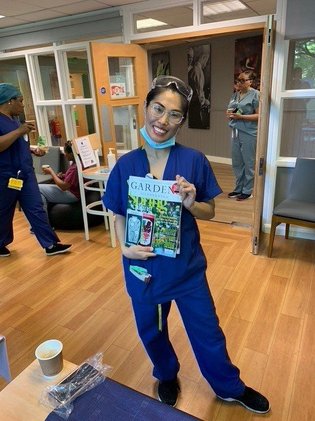 NHS worker with free magazine from Gold Key campaign